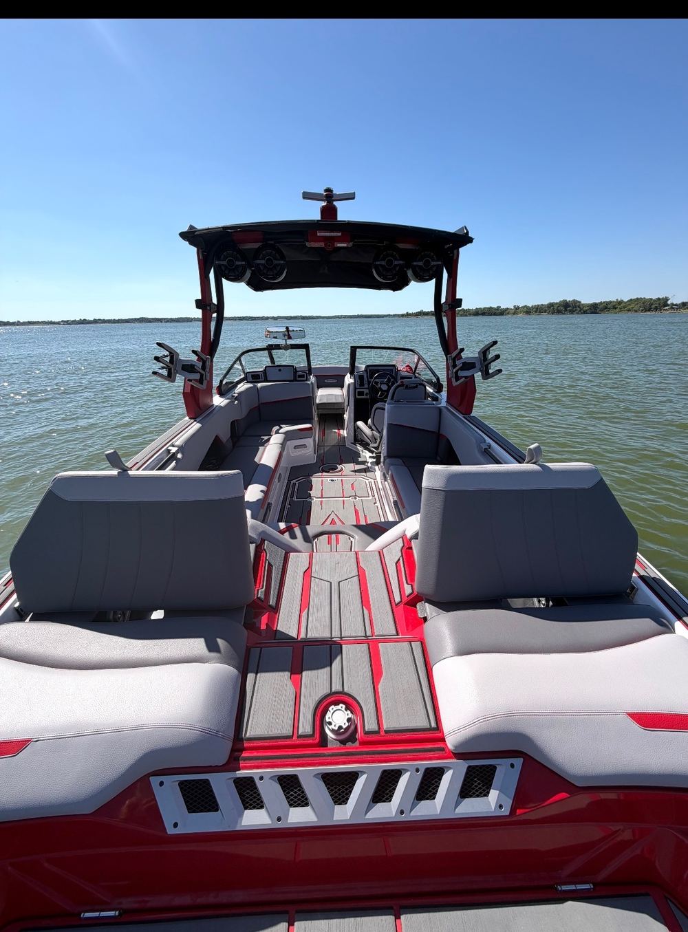 Our 2021 Supra SE 550, red and black, cockpit view on Broken Bow Lake